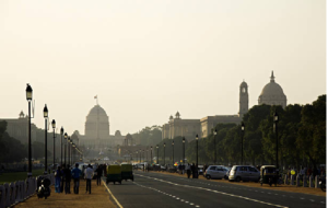 India Gate road in Delhi with people and vehicles