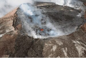 What are Sustainable & Eco-Friendly Destinations? A steam-filled crater, showcasing geological features and rugged landscape.
