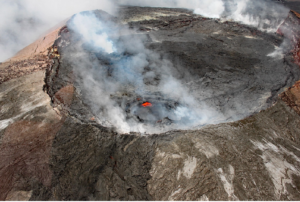 A steam-filled crater, showcasing geological features and rugged landscape.